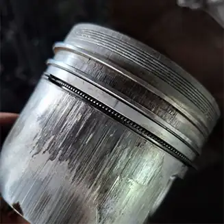 Damaged siezed engine piston inspected during independent engine failure assessment
